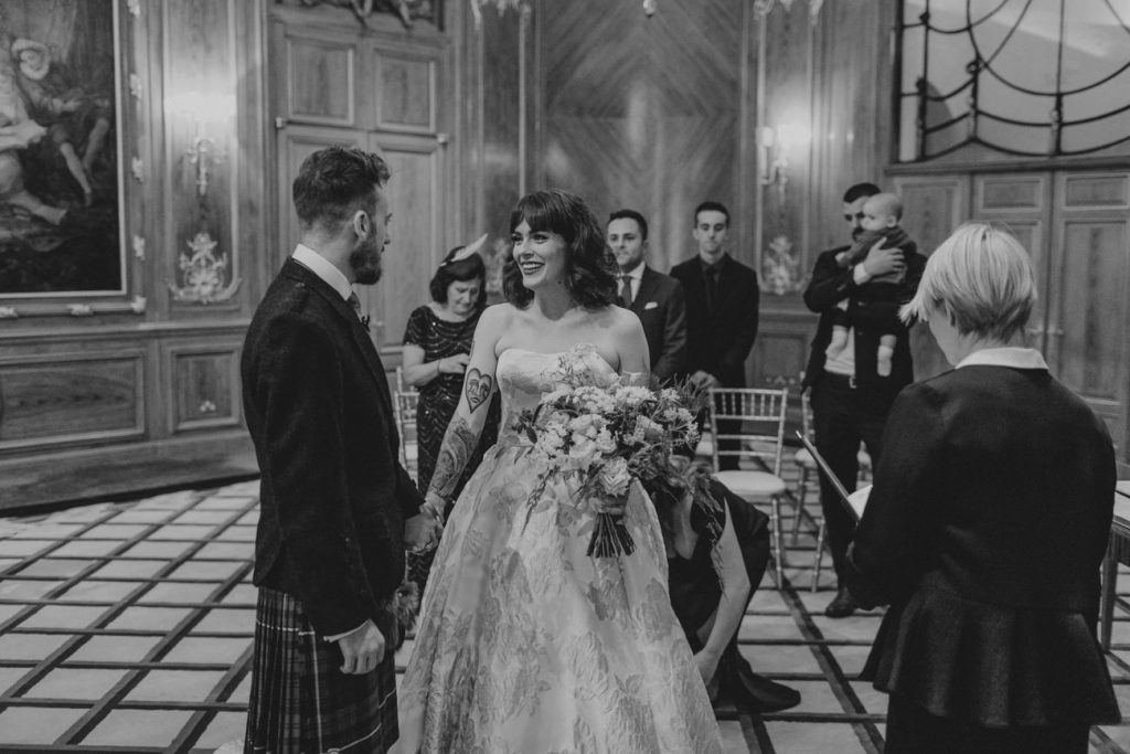 Bride and groom meet in the Art Deco room at Claridge's