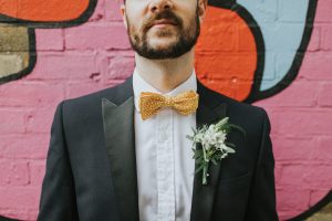 Groom Bow Tie London Micro Wedding Hackney Town Hall Bride and groom Portraits in arty Shoreditch Alternative Wedding Photographer We Heart Pictures